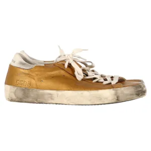Golden Goose Superstar Perforated Sneakers in Gold Leather